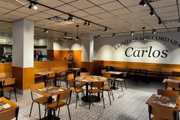 Pizzerías Carlos presenta su nueva identidad en la apertura de Vitoria